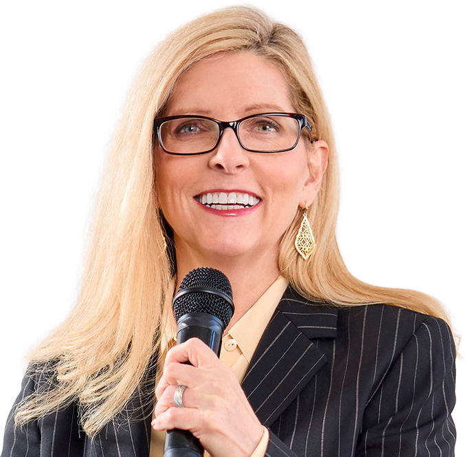 Dr. Joy Dahl speaking with microphone